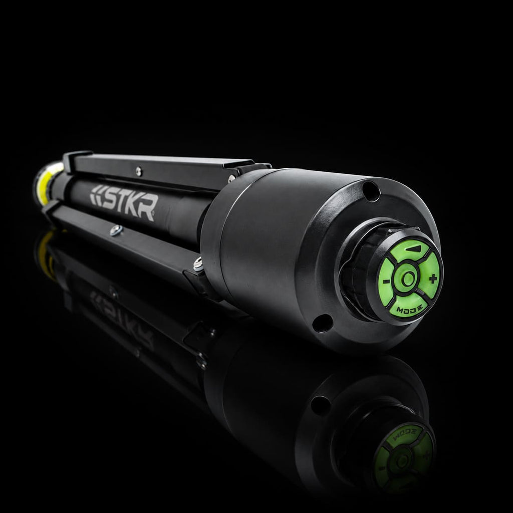 Folded up FLi-Pro Plus 10' Telescoping Area Light. camera focused on the bottom of the tripod showing us the magnetically attached FLi wireless remote..