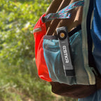 LP-EDC+ 8.0 Low Profile Everyday Carry Ultra-Thin Flashlight clipped onto the back of a backpack